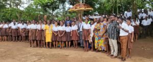Sammi Awuku cuts sod for ultramodern basketball, volleyball court in Okuapeman school